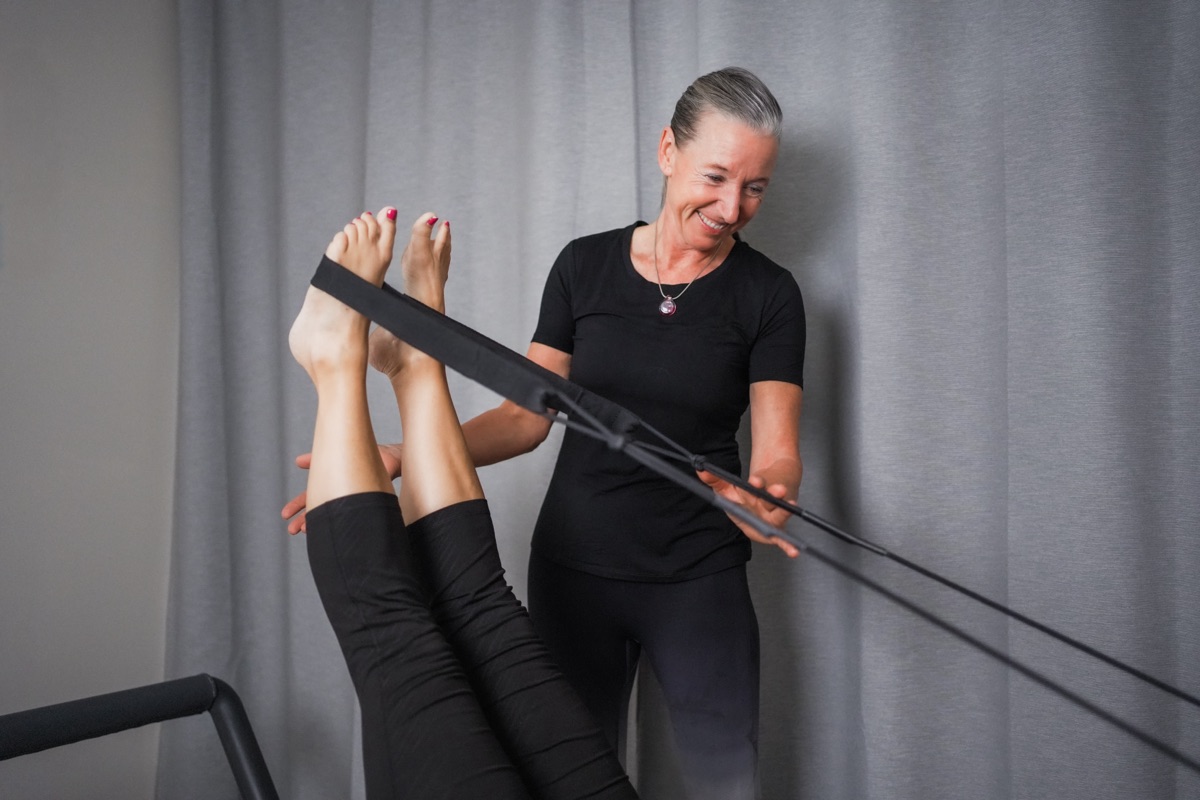 Elke providing hands-on Pilates instruction